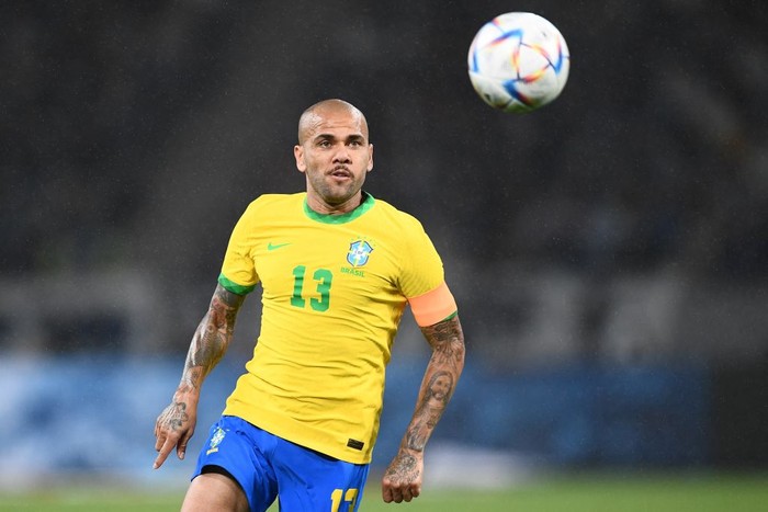 Brazil's Dani Alves runs with the ball during the friendly football match between Japan and Brazil at the National Stadium in Tokyo on June 6, 2022. (Photo by Charly TRIBALLEAU / AFP) (Photo by CHARLY TRIBALLEAU/AFP via Getty Images)