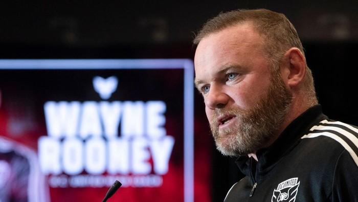 British soccer star Wayne Rooney speaks during a press conference where he was announced as the new Head Coach of Major League Soccers DC United at Audi Field in Washington, DC, on July 12, 2022. - Former England and Manchester United star Wayne Rooney was named on Tuesday as the new head coach of DC United and tasked with reviving the moribund Major League Soccer team. (Photo by ROBERTO SCHMIDT / AFP) (Photo by ROBERTO SCHMIDT/AFP via Getty Images)
