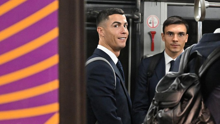 Cristiano Ronaldo DOHA, QATAR - NOVEMBER 18: Cristiano Ronaldo of Portugal and teammates look on from a Hyundai Airport Bus ahead of the FIFA World Cup Qatar 2022 at Hamad International Airport Special Events Terminal on November 18, 2022 in Doha, Qatar. (Photo by Tullio Puglia - FIFA/FIFA via Getty Images)