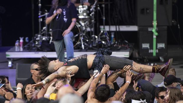 ENGLEWOOD, COLORADO - AUGUST 20: Crowd surfing during the Adolesents performance at the Punk in Drublic Craft Beer & Music Festival at Fiddler's Green Amphitheatre on August 20, 2022 in Englewood, Colorado. (Photo by Thomas Cooper/Getty Images)