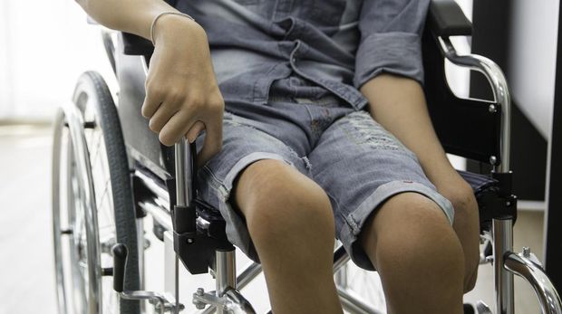 Disability polio patient sitting on wheelchair in hospital, Banner with copy space