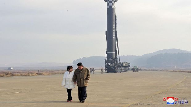 North Korean leader Kim Jong Un, along with his daughter, walks away from an intercontinental ballistic missile (ICBM) in this undated photo released on November 19, 2022 by North Korea's Korean Central News Agency (KCNA). KCNA via REUTERS ATTENTION EDITORS - THIS IMAGE WAS PROVIDED BY A THIRD PARTY. NO THIRD PARTY SALES. SOUTH KOREA OUT. NO COMMERCIAL OR EDITORIAL SALES IN SOUTH KOREA. REUTERS IS UNABLE TO INDEPENDENTLY VERIFY THIS IMAGE.