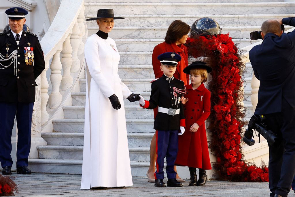 Princess Charlene of Monaco (2ndL), Princess Stephanie of Monaco, Prince Jacques and Princess Gabriella attend celebrations as part of ceremonies marking the National Day at the Palace in Monaco on November 19, 2022. (Photo by ERIC GAILLARD / POOL / AFP) (Photo by ERIC GAILLARD/POOL/AFP via Getty Images)