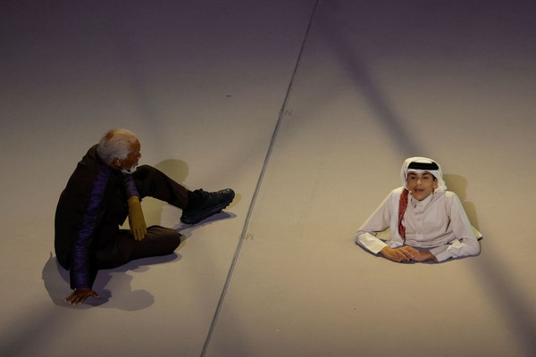 US actor Morgan Freeman (L) and Qatari YouTuber Ghanim al Muftah speak during the opening ceremony ahead of the Qatar 2022 World Cup Group A football match between Qatar and Ecuador at the Al-Bayt Stadium in Al Khor, north of Doha on November 20, 2022. (Photo by Odd ANDERSEN / AFP) (Photo by ODD ANDERSEN/AFP via Getty Images)