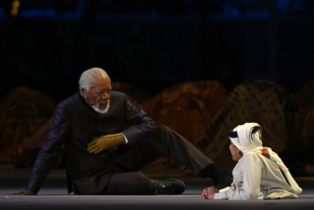 US actor Morgan Freeman (L) and Qatari YouTuber Ghanim al Muftah speak during the opening ceremony ahead of the Qatar 2022 World Cup Group A football match between Qatar and Ecuador at the Al-Bayt Stadium in Al Khor, north of Doha on November 20, 2022. (Photo by Odd ANDERSEN / AFP) (Photo by ODD ANDERSEN/AFP via Getty Images)