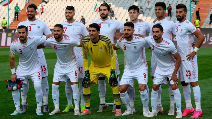 Irans players pose for a group picture ahead of the World Cup Qatar 2022 Group C qualification football match between Iran and Cambodia at the Azadi stadium in the capital Tehran on October 10, 2019. (Photo by ATTA KENARE / AFP) (Photo by ATTA KENARE/AFP via Getty Images)