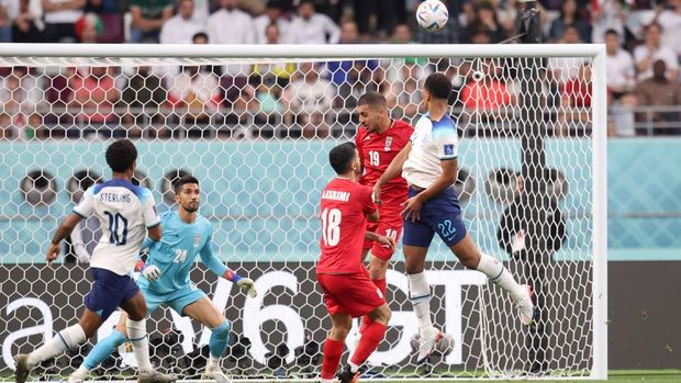 DOHA, QATAR - NOVEMBER 21: Jude Bellingham of England scores their team's first goal during the FIFA World Cup Qatar 2022 Group B match between England and IR Iran at Khalifa International Stadium on November 21, 2022 in Doha, Qatar. (Photo by Alex Pantling - The FA/The FA via Getty Images)