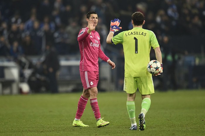 Real Madrids Portuguese forward Cristiano Ronaldo (L) and Real Madrids goalkeeper Iker Casillas react after the last 16, first-leg UEFA Champions League football match FC Schalke 04 vs Real Madrid in Gelsenkirchen, western Germany on February 18, 2015. Real Madrid won 0-2.  AFP PHOTO / ODD ANDERSEN        (Photo credit should read ODD ANDERSEN/AFP via Getty Images)