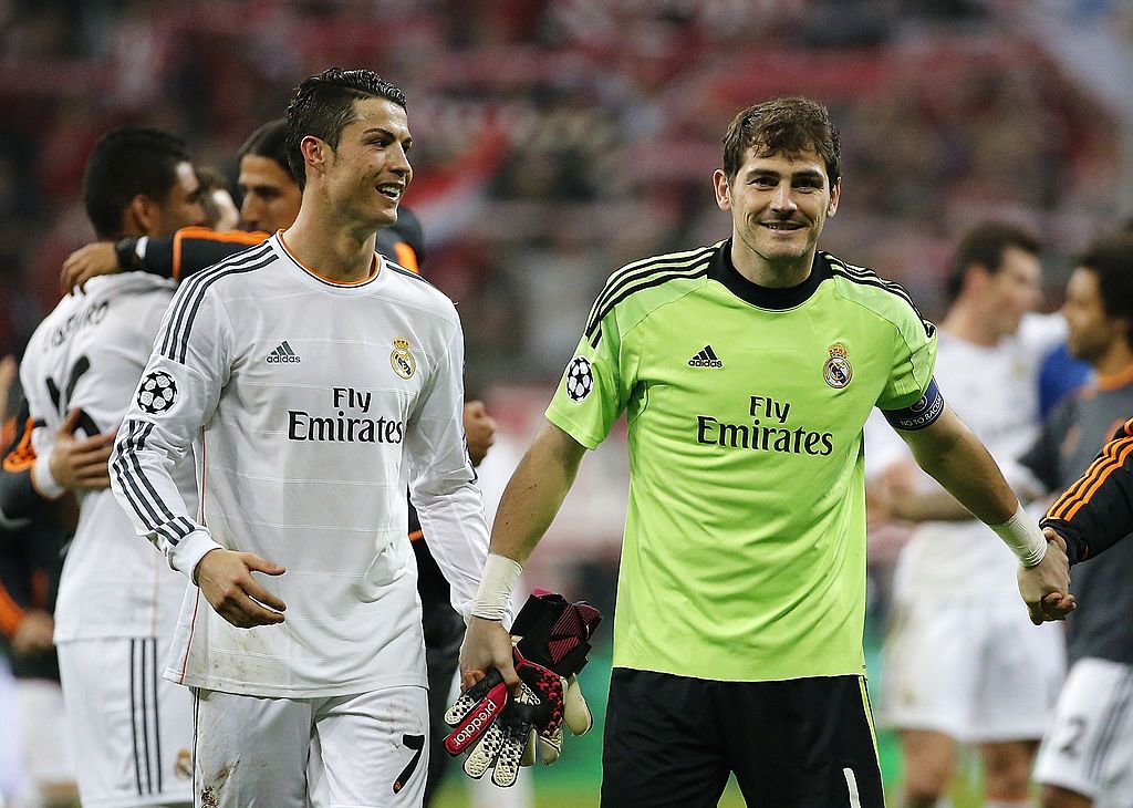 Real Madrid's Portuguese forward Cristiano Ronaldo (L) and Real Madrid's goalkeeper Iker Casillas react after the last 16, first-leg UEFA Champions League football match FC Schalke 04 vs Real Madrid in Gelsenkirchen, western Germany on February 18, 2015. Real Madrid won 0-2.  AFP PHOTO / ODD ANDERSEN        (Photo credit should read ODD ANDERSEN/AFP via Getty Images)