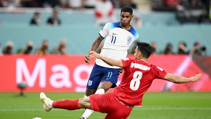 DOHA, QATAR - NOVEMBER 21: Marcus Rashford of England scores their teams fifth goal during the FIFA World Cup Qatar 2022 Group B match between England and IR Iran at Khalifa International Stadium on November 21, 2022 in Doha, Qatar. (Photo by Matthias Hangst/Getty Images)