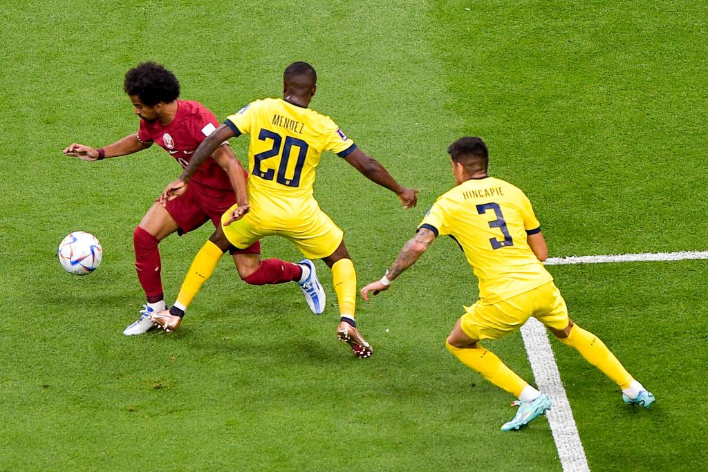 AL KHOR, QATAR - NOVEMBER 20: Akram Afif of Qatar battles for the ball with Jhegson Mendez of Ecuador and Piero Hincapie of Ecuador during the Group A - FIFA World Cup Qatar 2022 match between Qatar and Ecuador at Al Bayt Stadium on November 20, 2022 in Al Khor, Qatar (Photo by Pablo Morano/BSR Agency/Getty Images)