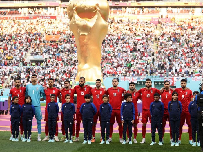 DOHA, QATAR - NOVEMBER 21: Iran players line up for the national anthem prior to the FIFA World Cup Qatar 2022 Group B match between England and IR Iran at Khalifa International Stadium on November 21, 2022 in Doha, Qatar. (Photo by Julian Finney/Getty Images)