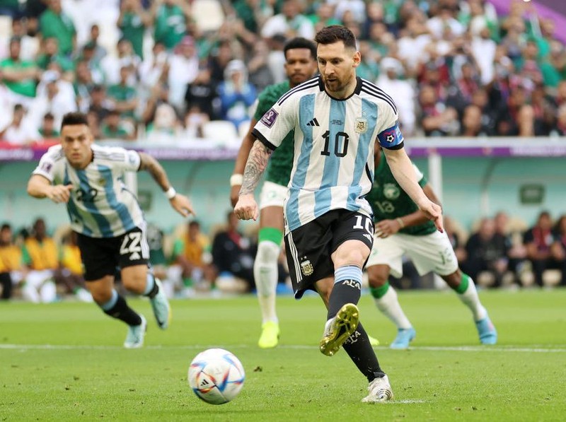 LUSAIL CITY, QATAR - NOVEMBER 22: Lionel Messi of Argentina scores their team's first goal via a penalty during the FIFA World Cup Qatar 2022 Group C match between Argentina and Saudi Arabia at Lusail Stadium on November 22, 2022 in Lusail City, Qatar. (Photo by Catherine Ivill/Getty Images)