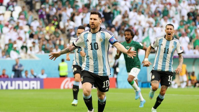 LUSAIL CITY, QATAR - NOVEMBER 22: Lionel Messi of Argentina celebrates after scoring their teams first goal from the penalty spot during the FIFA World Cup Qatar 2022 Group C match between Argentina and Saudi Arabia at Lusail Stadium on November 22, 2022 in Lusail City, Qatar. (Photo by Catherine Ivill/Getty Images)