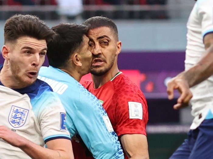 DOHA, QATAR - NOVEMBER 21: Iran goalkeeper Alireza Beiranvand collides with his teammate Majid Hosseini during the FIFA World Cup Qatar 2022 Group B match between England and IR Iran at Khalifa International Stadium on November 21, 2022 in Doha, Qatar. (Photo by Charlotte Wilson/Offside/Offside via Getty Images)