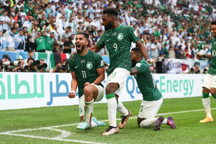 LUSAIL CITY, QATAR - NOVEMBER 22: Saleh Al-Shehri of Saudi Arabia celebrates with his team mates after scoring a goal to make it 1-1 during the FIFA World Cup Qatar 2022 Group C match between Argentina and Saudi Arabia at Lusail Stadium on November 22, 2022 in Lusail City, Qatar. (Photo by James Williamson - AMA/Getty Images)