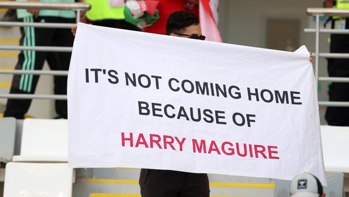 Harry Maguire DOHA, QATAR - NOVEMBER 21: A fan holds a banner with a message