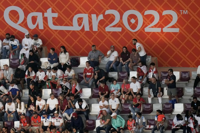 Fans watch during the World Cup group B soccer match between England and Iran at the Khalifa International Stadium in in Doha, Qatar, Monday, Nov. 21, 2022. (AP Photo/Hassan Ammar)