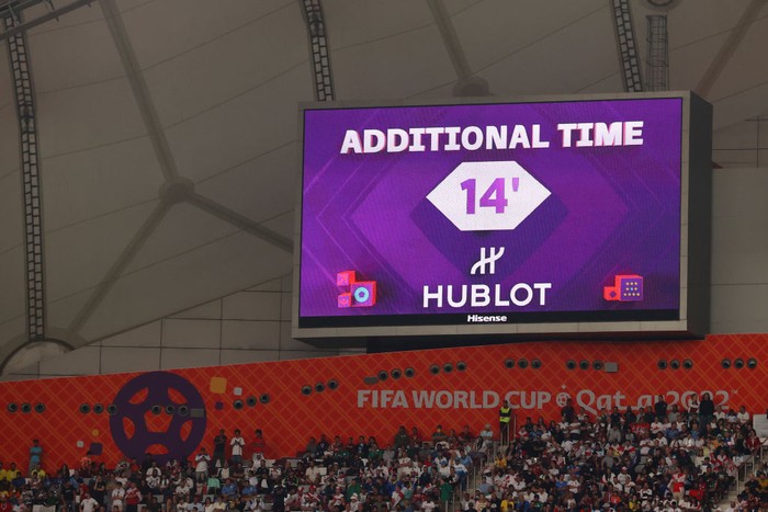 DOHA, QATAR - NOVEMBER 21: A giant screen displays additional time of 14 minutes as Alireza Beiranvand of IR Iran received medical treatment during the FIFA World Cup Qatar 2022 Group B match between England and IR Iran at Khalifa International Stadium on November 21, 2022 in Doha, Qatar. (Photo by Julian Finney/Getty Images)