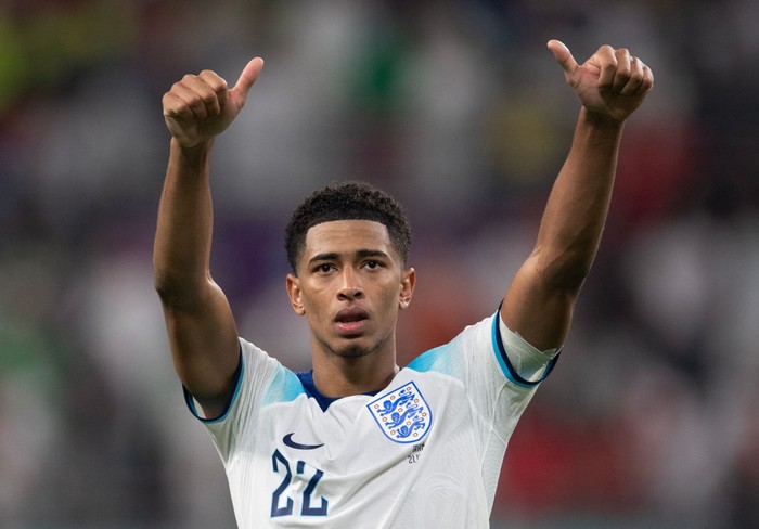 Jude Bellingham DOHA, QATAR - NOVEMBER 21: Jude Bellingham of England scores their team's first goal during the FIFA World Cup Qatar 2022 Group B match between England and IR Iran at Khalifa International Stadium on November 21, 2022 in Doha, Qatar. (Photo by Clive Brunskill/Getty Images)