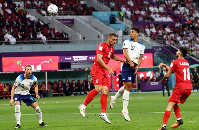 Jude Bellingham DOHA, QATAR - NOVEMBER 21: Jude Bellingham of England scores their team's first goal during the FIFA World Cup Qatar 2022 Group B match between England and IR Iran at Khalifa International Stadium on November 21, 2022 in Doha, Qatar. (Photo by Clive Brunskill/Getty Images)