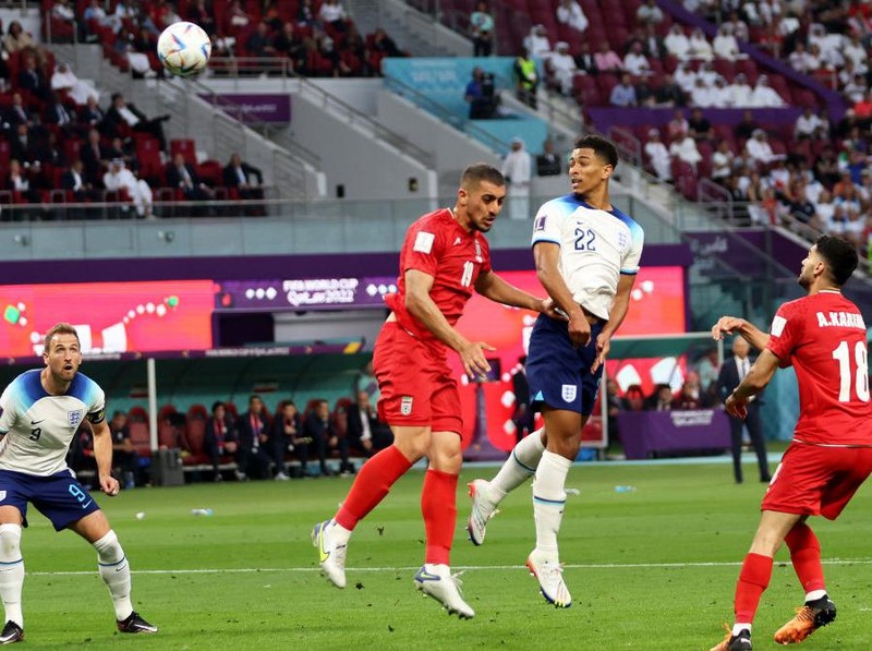 DOHA, QATAR - NOVEMBER 21: Jude Bellingham of England scores their team's first goal during the FIFA World Cup Qatar 2022 Group B match between England and IR Iran at Khalifa International Stadium on November 21, 2022 in Doha, Qatar. (Photo by Clive Brunskill/Getty Images)