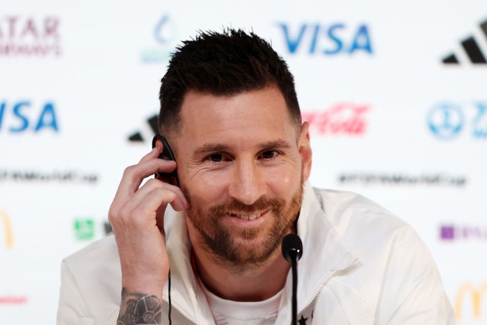 DOHA, QATAR - NOVEMBER 21: Lionel Messi of Argentina reacts during the Argentina match day -1 Press Conference at Main Media Center on November 21, 2022 in Doha, Qatar. (Photo by Mohamed Farag/Getty Images)