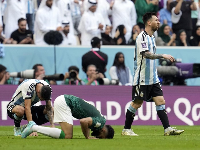 Argentina's Lionel Messi leaves the pitch after losing the World Cup group C soccer match between Argentina and Saudi Arabia at the Lusail Stadium in Lusail, Qatar, Tuesday, Nov. 22, 2022. (AP Photo/Natacha Pisarenko)