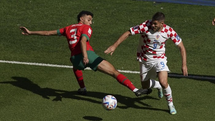 AL KHOR, QATAR - NOVEMBER 23: Noussair Mazraoui (3) of Morocco in action against Andrej Kramaric (9) of Croatia during FIFA World Cup Qatar 2022 Group F match between Morocco and Croatia at Al Bayt Stadium in Al Khor City, Qatar on November 23, 2022. (Photo by Ercin Erturk/Anadolu Agency via Getty Images)
