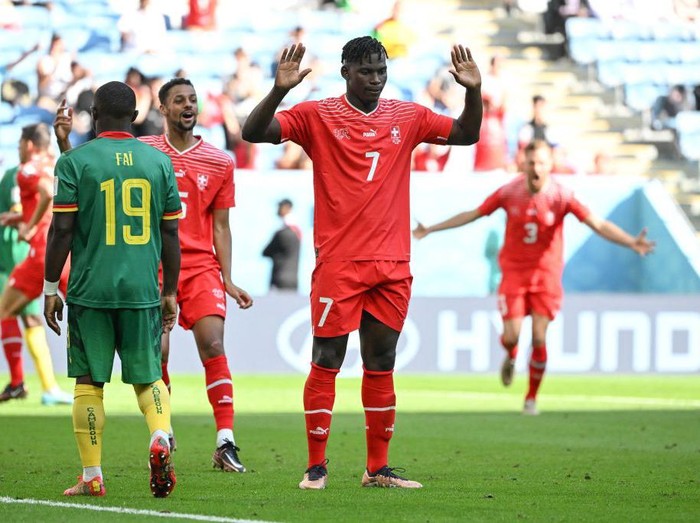 Switzerlands forward #07 Breel Embolo celebrates scoring his teams first goal during the Qatar 2022 World Cup Group G football match between Switzerland and Cameroon at the Al-Janoub Stadium in Al-Wakrah, south of Doha on November 24, 2022. (Photo by FABRICE COFFRINI / AFP) (Photo by FABRICE COFFRINI/AFP via Getty Images)