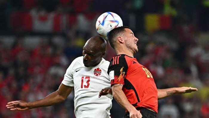 Belgiums forward #10 Eden Hazard heads the ball before Canadas midfielder #13 Atiba Hutchinson during the Qatar 2022 World Cup Group F football match between Belgium and Canada at the Ahmad Bin Ali Stadium in Al-Rayyan, west of Doha on November 23, 2022. (Photo by Anne-Christine POUJOULAT / AFP) (Photo by ANNE-CHRISTINE POUJOULAT/AFP via Getty Images)