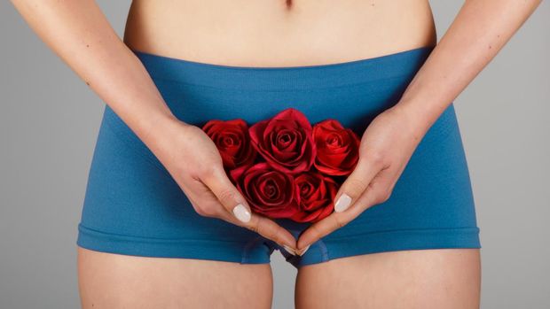 Intimate part of a woman's body with roses