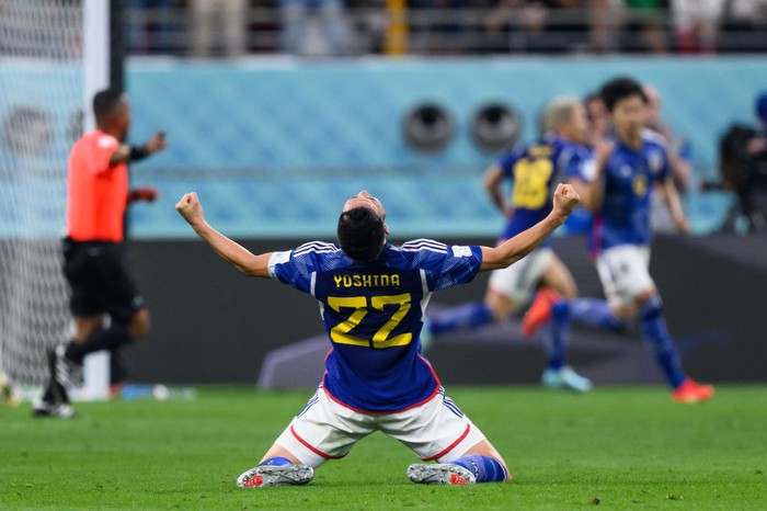 23 November 2022, Qatar, Ar-Rayyan: Soccer: World Cup, Germany - Japan, preliminary round, Group E, Matchday 1, Khalifa International Stadium. Japans Takuma Asano (r) scores against Germanys Nico Schlotterbeck (M) and Germanys goalkeeper Manuel Neuer for 1-2. Photo: Robert Michael/dpa (Photo by Robert Michael/picture alliance via Getty Images)