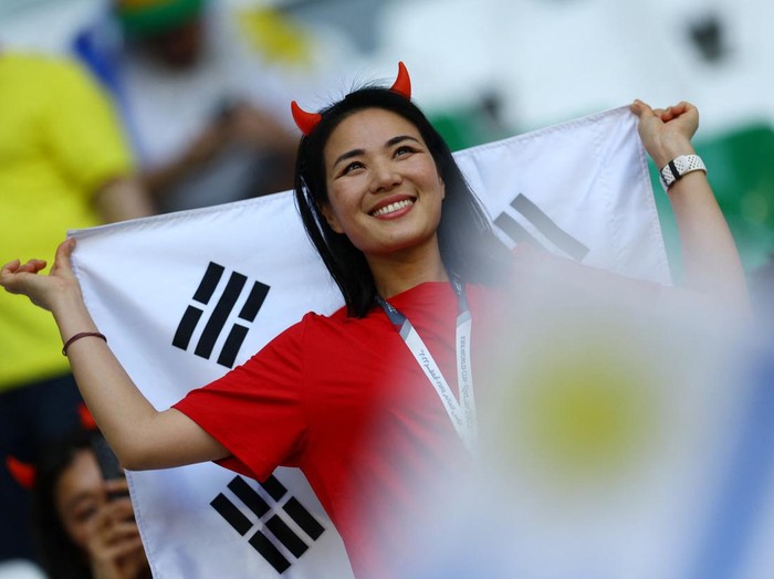 Soccer Football - FIFA World Cup Qatar 2022 - Group H - Uruguay v South Korea - Education City Stadium, Al Rayyan, Qatar - November 24, 2022  A South Korea fan inside the stadium before the match REUTERS/Kai Pfaffenbach