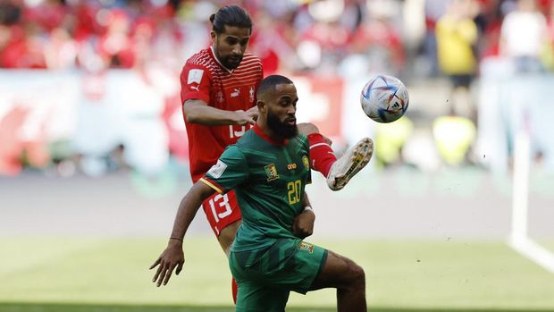 Soccer Football - FIFA World Cup Qatar 2022 - Group G - Switzerland v Cameroon - Al Janoub Stadium, Al Wakrah, Qatar - November 24, 2022 Cameroon's Bryan Mbeumo in action with Switzerland's Ricardo Rodriguez REUTERS/Issei Kato