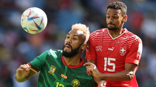 Soccer Football - FIFA World Cup Qatar 2022 - Group G - Switzerland v Cameroon - Al Janoub Stadium, Al Wakrah, Qatar - November 24, 2022 Cameroon's Eric Maxim Choupo-Moting in action with Switzerland's Djibril Sow REUTERS/Carl Recine