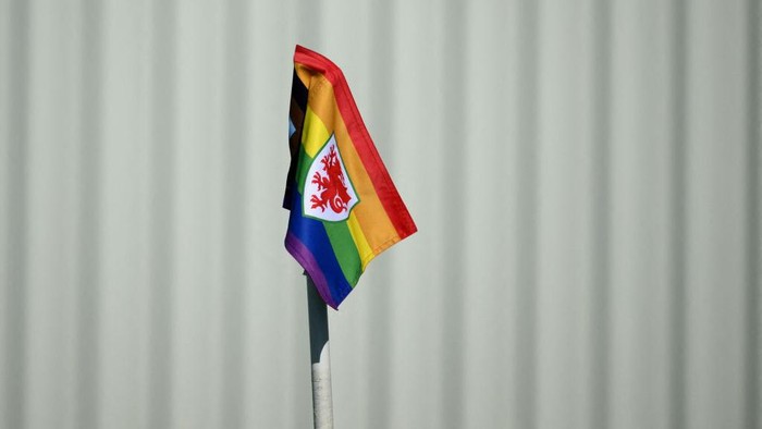 TOPSHOT - A rainbow flag with the Wales blazon is displayed at the Al Saad SC in Doha on November 23, 2022, during the Qatar 2022 World Cup football tournament. (Photo by Nicolas TUCAT / AFP) (Photo by NICOLAS TUCAT/AFP via Getty Images)