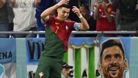 Berbeda dengan Messi dan Argentina, Ronaldo berhasil membawa Portugal menang 3-2 atas Ghana di akhir pertandingan. (Foto: AFP via Getty Images/MANAN VATSYAYANA)