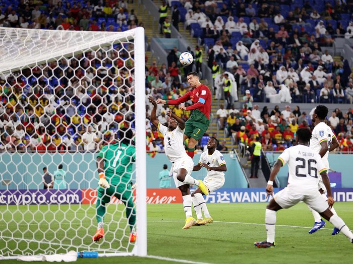 DOHA, QATAR - NOVEMBER 24: Cristiano Ronaldo of Portugal competes for a header against Mohammed Salisu of Ghana during the FIFA World Cup Qatar 2022 Group H match between Portugal and Ghana at Stadium 974 on November 24, 2022 in Doha, Qatar. (Photo by Julian Finney/Getty Images)
