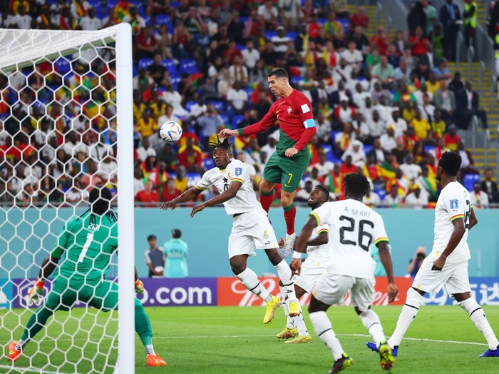 24 November 2022, Qatar, Doha: Soccer: World Cup, Portugal - Ghana, Preliminary Round, Group H, Matchday 1, Stadium 974, Cristiano Ronaldo (M) of Portugal against Mohammed Salisu (2nd from left) of Ghana in a header duel. Photo: Tom Weller/dpa (Photo by Tom Weller/picture alliance via Getty Images)