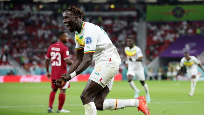 DOHA, QATAR - NOVEMBER 25: Famara Diedhiou of Senegal celebrates after scoring their teams second goal during the FIFA World Cup Qatar 2022 Group A match between Qatar and Senegal at Al Thumama Stadium on November 25, 2022 in Doha, Qatar. (Photo by Alex Grimm/Getty Images)
