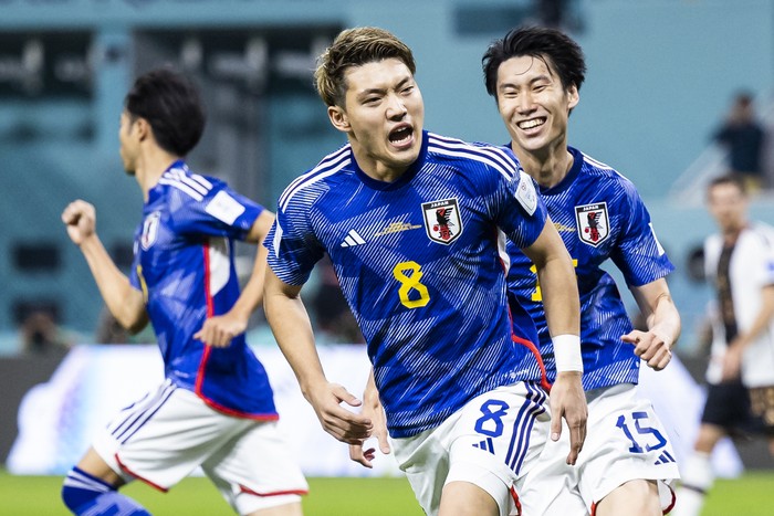 23 November 2022, Qatar, Ar-Rayyan: Soccer: World Cup, Germany - Japan, Preliminary Round, Group E, Matchday 1, Chalifa International Stadium, Japans Ritsu Doan (M) celebrates with Japans Daichi Kamada (r) after his goal to make it 1-1. Photo: Tom Weller/dpa (Photo by Tom Weller/picture alliance via Getty Images)