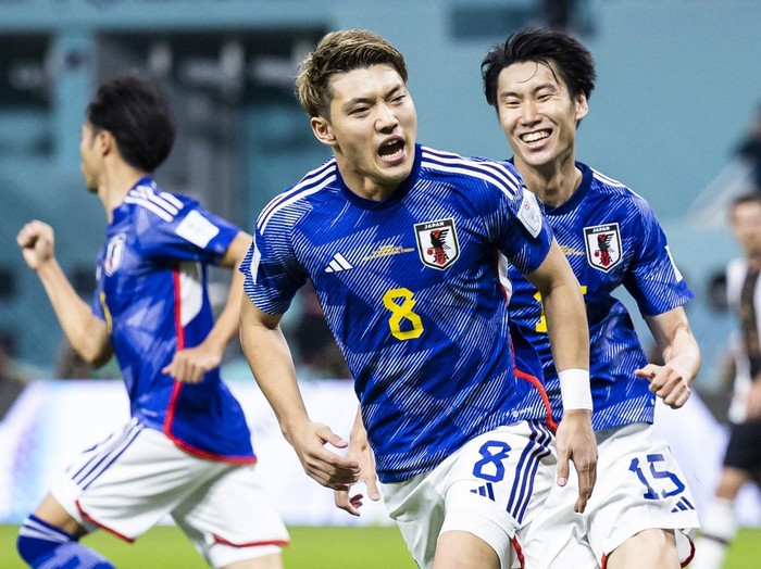 23 November 2022, Qatar, Ar-Rayyan: Soccer: World Cup, Germany - Japan, Preliminary Round, Group E, Matchday 1, Chalifa International Stadium, Japan's Ritsu Doan (M) celebrates with Japan's Daichi Kamada (r) after his goal to make it 1-1. Photo: Tom Weller/dpa (Photo by Tom Weller/picture alliance via Getty Images)