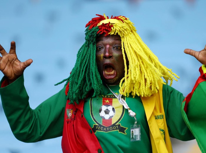 Soccer Football - FIFA World Cup Qatar 2022 - Group G - Switzerland v Cameroon - Al Janoub Stadium, Al Wakrah, Qatar - November 24, 2022 A Cameroon fan inside the stadium before the match REUTERS/Hannah Mckay