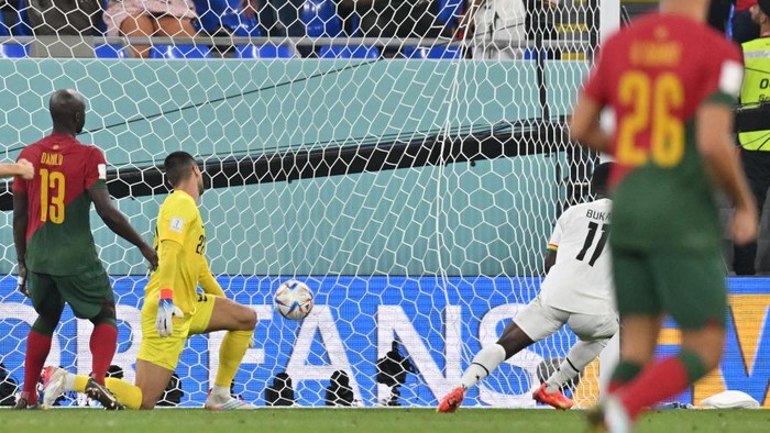 Osman Bukari vs Portugal Ghana's forward #11 Osman Bukari (2nd R) scores his team's second goal past Portugal's goalkeeper #22 Diogo Costa (2nd L) during the Qatar 2022 World Cup Group H football match between Portugal and Ghana at Stadium 974 in Doha on November 24, 2022. (Photo by Glyn KIRK / AFP) (Photo by GLYN KIRK/AFP via Getty Images)