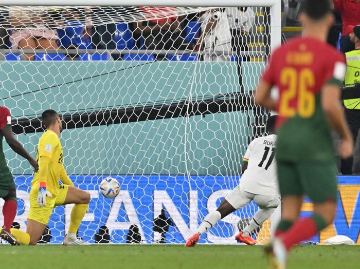 Ghana's forward #11 Osman Bukari (2nd R) scores his team's second goal past Portugal's goalkeeper #22 Diogo Costa (2nd L) during the Qatar 2022 World Cup Group H football match between Portugal and Ghana at Stadium 974 in Doha on November 24, 2022. (Photo by Glyn KIRK / AFP) (Photo by GLYN KIRK/AFP via Getty Images)