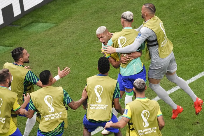 Richarlison vs Serbia Brazil's Richarlison , background left, celebrates with teammates after scoring the second goal of his team against Serbia during the World Cup group G soccer match between Brazil and Serbia, at the the Lusail Stadium in Lusail, Qatar on Thursday, Nov. 24, 2022. (AP Photo/Darko Vojinovic)
