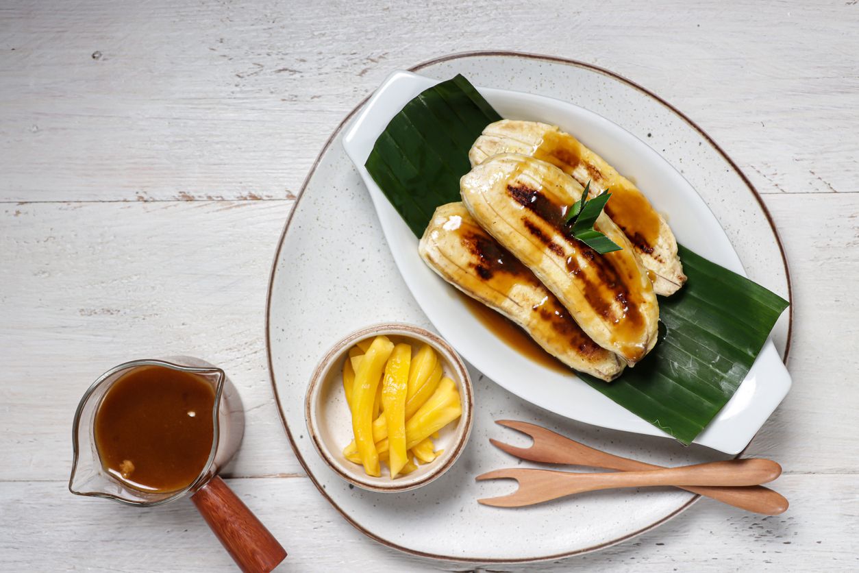 Pisang Gapit or pisang Epe is Grilled banana with coconut brown sugar sauce