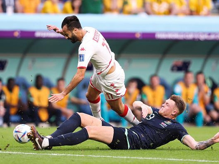 AL WAKRAH, QATAR - NOVEMBER 26: Taha Yassine Khenissi of Tunisia is tackled by Harry Souttar of Australia  during the FIFA World Cup Qatar 2022 Group D match between Tunisia and Australia at Al Janoub Stadium on November 26, 2022 in Al Wakrah, Qatar. (Photo by Alex Livesey - Danehouse/Getty Images)
