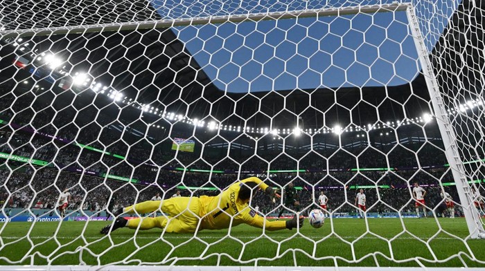 Poland's goalkeeper #01 Wojciech Szczesny stops a penalty by Saudi Arabia's midfielder #10 Salem Al-Dawsari during the Qatar 2022 World Cup Group C football match between Poland and Saudi Arabia at the Education City Stadium in Al-Rayyan, west of Doha on November 26, 2022. (Photo by ANDREJ ISAKOVIC / AFP) (Photo by ANDREJ ISAKOVIC/AFP via Getty Images)